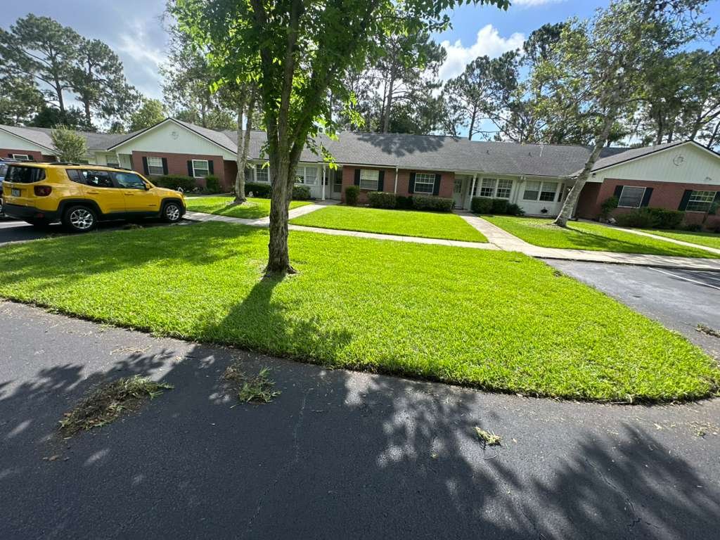 Freshly mowed commercial turf along a Jacksonville roadway