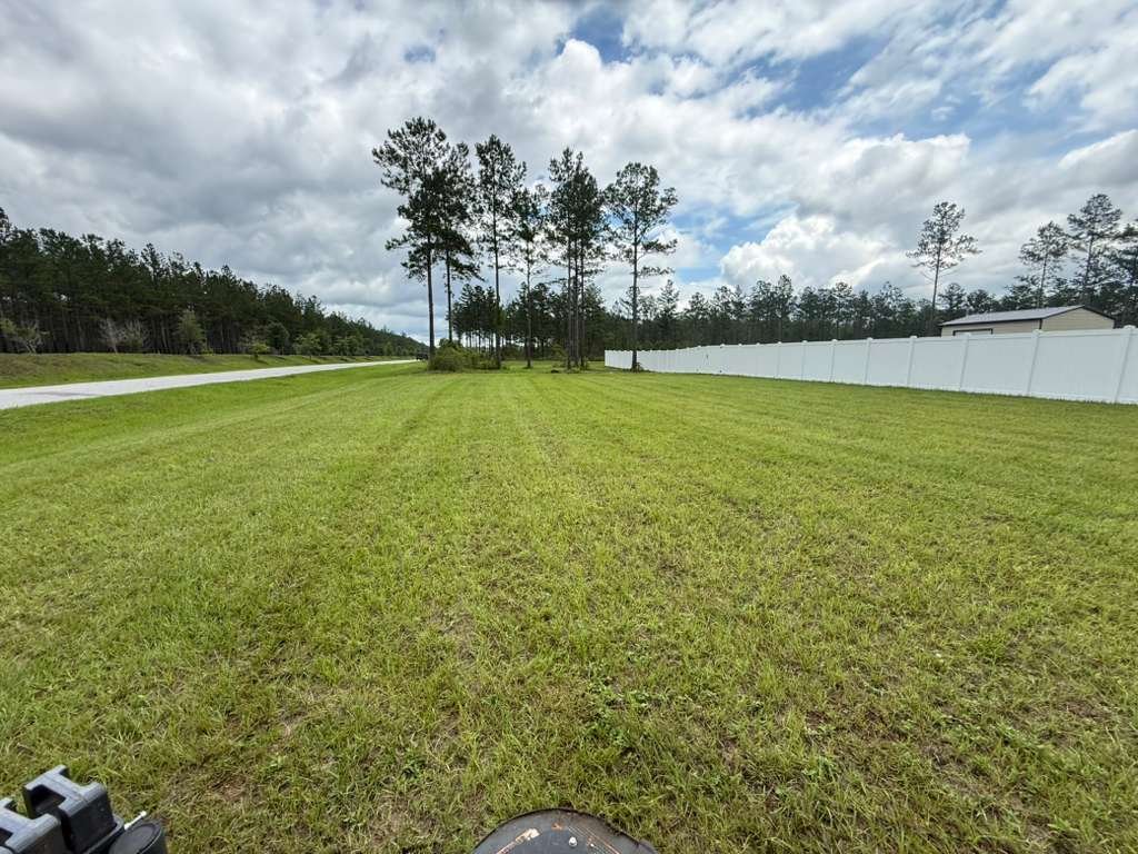 Freshly striped commercial turf lawn along a Jacksonville street